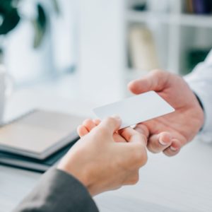 cropped image of patient giving empty card to doctor in clinic - Savannah Endocrinology - Savannah, GA.